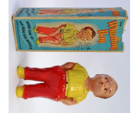 WHISTLING BOY; Interesting vintage ' The Whistling Boy ' plastic toy. Clockwork action. Within the original box.