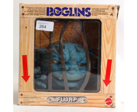 BOGLINS; An original vintage Boglins ' Flup ' action figure. Within the original display 'cage' box. Made by Mattel. 