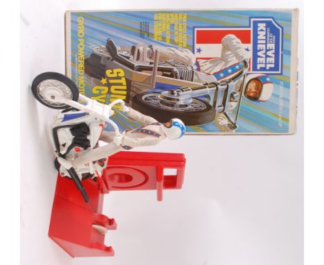 EVEL KNIEVEL; Retro vintage 1970's Evel Knievel Stunt Cycle by Ideal. Complete with figure, cycle, and two part base. In a go