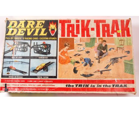 SPOT ON TRIK TRAK; A vintage Trik Trak Dare Devil stunt set game, made by Spot On. Comes with both original cars (and their b