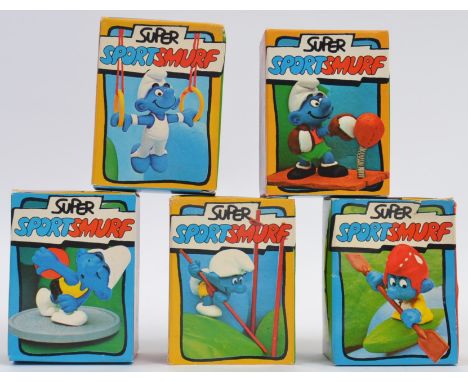 SMURFS; A great collection of 5x vintage original Schleich ' Super Sport Smurf ' figures, each within the original boxes; Rin