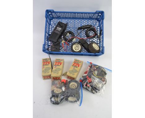 TAMIYA; A collection of assorted vintage Tamiya radio controlled car accessories to include Batteries, wheels, various electr