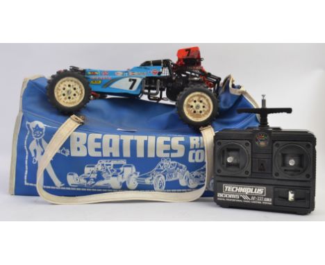 TAMIYA; An original vintage iconic Tamiya ' Hotshot ' radio controlled car. Comes within an original retro blue Beatties carr