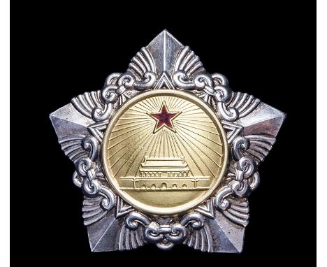 *China, People’s Republic, Order of Liberation, Third Class badge, in silver with gilt centre and red enamelled star, reverse