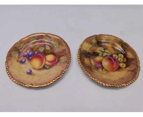 Two Royal Worcester Mid 20th Century rope edged Tea plates , decorated with fruits one signed J Smith , the other signature i