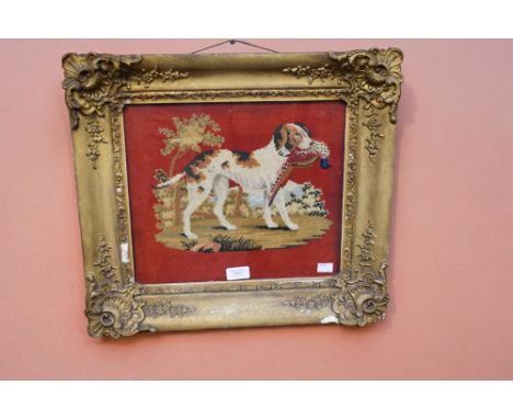 A late 19th century Berlin woolwork tapestry depicting a dog with a pheasant in its mouth, in a gilt frame, 30cm x 34cm