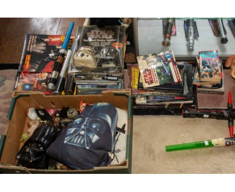 ***ITEM LOCATED AT BISHTON HALL*** A large collection of Star Wars memorabilia to include books, magazine, DVDs and videos, a