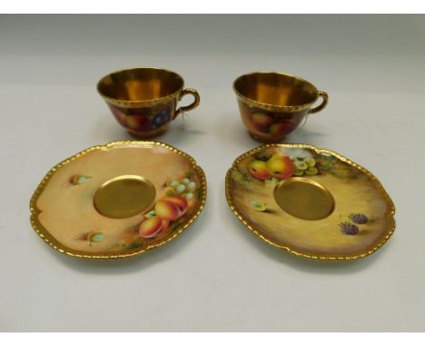 Two Royal Worcester Mid 20th Century rope edged Cups and Saucers , decorated with fruits one signed J Smith ,the other signed