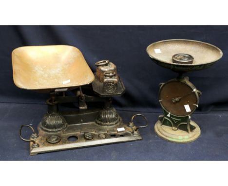 A set of Victorian cast iron kitchen scales along with cast Edwardian scales.
