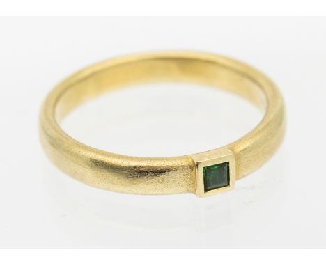 An emerald and 14ct gold ring, comprising a square cut emerald approx 2.5mm, rub over set to a court shaped band, width appro