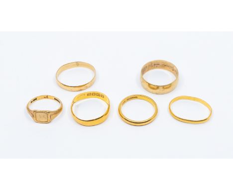 A collection of weighable gold rings to include three 22ct gold bands (some misshaped) weight approx 7.7gms, along with two 9
