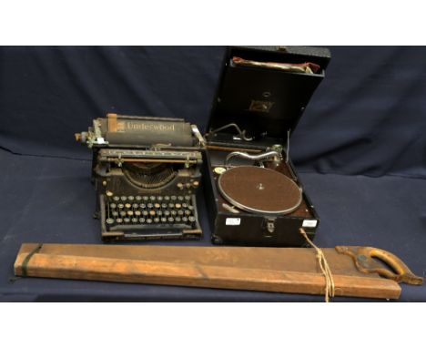 An early 20th century Underwood manueeeeal typewriter; together with a cased His Masters Voice (HMV) Model 101 gramaphone and