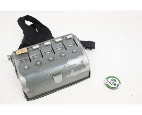 A railway ticket machine, unmarked, together with a Public Service Vehicle Conductor Badge BB 76389. (2)