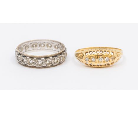 A diamond and 18ct gold boat head, size O, total gross weight approx 1.9gms, (worn) along with a white stone set eternity rin