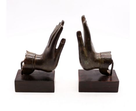 A pair of bronze deity hands on stands bookends, 19th Century.