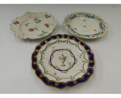 A collection of three 18th Century porcelain plates, two with archer mark, gold and red, other with continental arrow mark, h