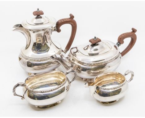 A 20th century four-piece silver plated tea set consisting of tea pot, coffee pot, sugar bowl and milk jug, all with Celtic d
