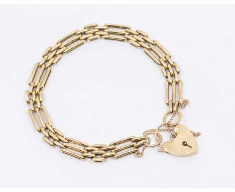A 9ct gold gate link bracelet, width approx 8mm, with padlock clasp, length approx 21cm, weight approx 13.3gms  Further detai