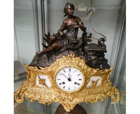 A late 19th Century French spelter mantle clock with gilt and bronze detail, Roman numerals, 8 day.