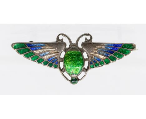 Charles Horner- an Egyptian revival silver and enamel winged scarab brooch, with green and blue enamel decoration, length apr