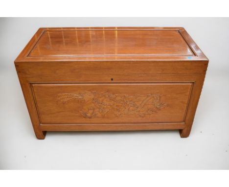 A mid 20th Century light hardwood Chinese coffer.