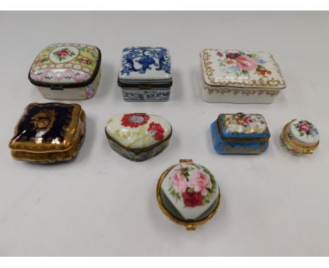 A collection of 20th Century porcelain English and continental trinket boxes.(8)