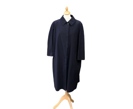 A black Margaret Howell coat in a classic style, peter pan collar, size 14.