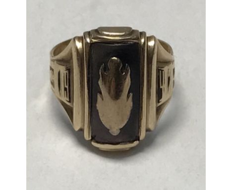 A WW2 Interest, a 9ct gold ring inlaid with black lip oyster shell, over lid with what appears to be an oak leaf motif within