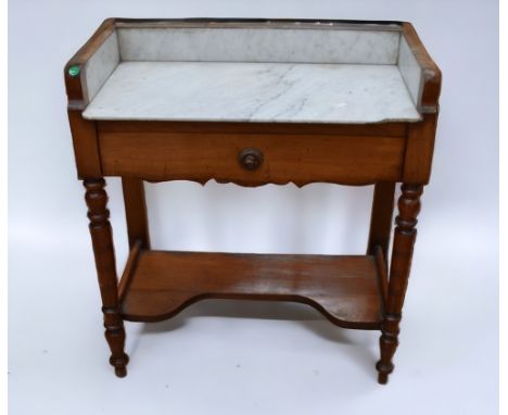 A Victorian marble top mahogany wash stand with single drawer and base shelf.