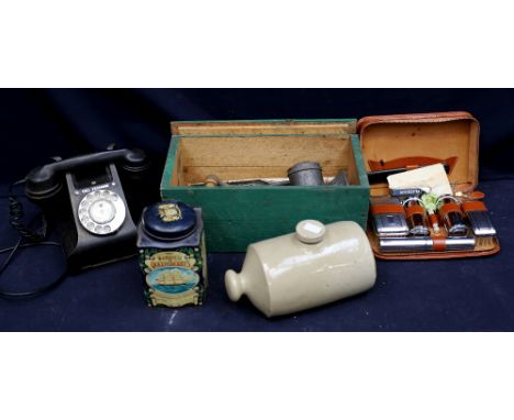 A 1930s vintage telephone, vintage tins, meat grinder, stone ware, hot water foot warmer etc.