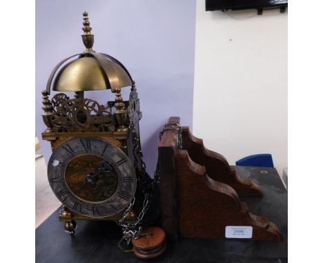A reproduction 30hr lantern clock with wall bracket, one weight, hour hand only.