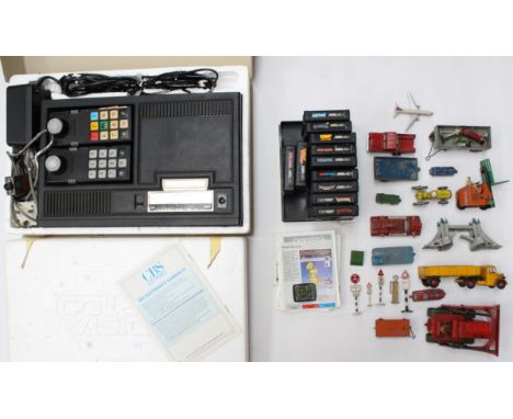 A boxed CBS Coleco Vision games console with assorted cartridges, untested for working order; together with a collection of a