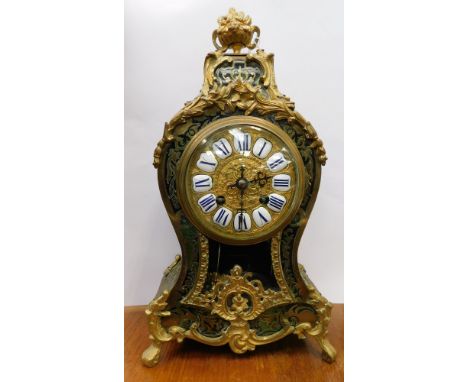 A 19th century French Boullework style mantleclock, with applied brass decoration, the brass dial with white enamel Roman num