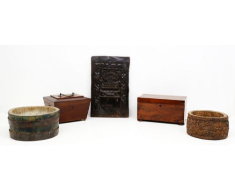 A 19th century mahogany tea caddy of sarcophagus shape, with twin lion handles and twin compartment inside, with Georgian sil