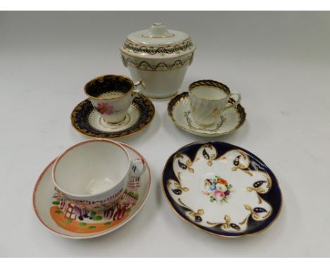 A collection of early 19th Century porcelain cups/saucers with hand painted and gilt detail with sugar bowl and lid.  Sugar B