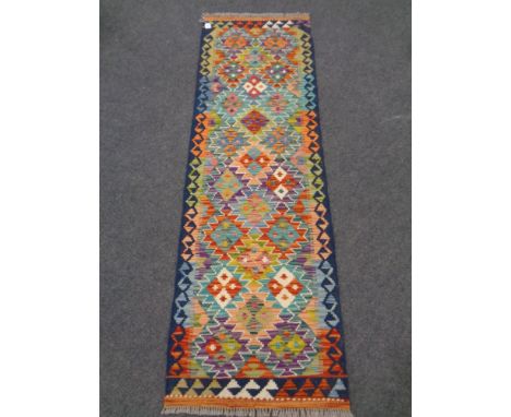 A Chobi kilim runner 194cm by 62cm 