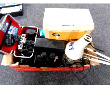 A box of cased Durham delux binoculars, Praktica camera with lens, angle poise lamp, Boots projector etc 