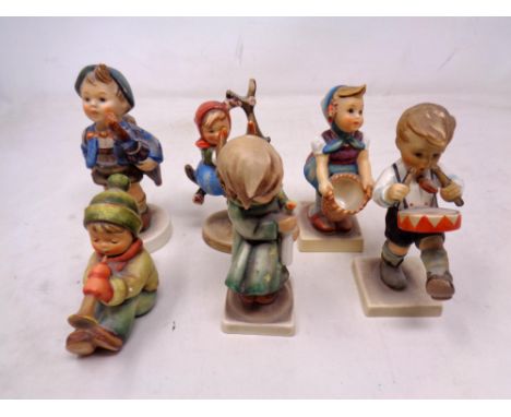 A group of six West German Goebel figures of children 