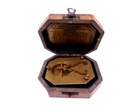 A reproduction F Cox of London brass sundial compass in fitted box.