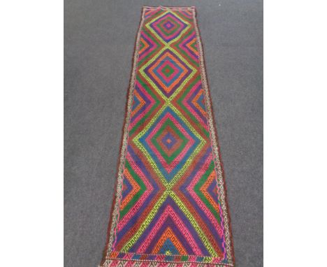 A Suzni kilim runner 293cm by 76cm 