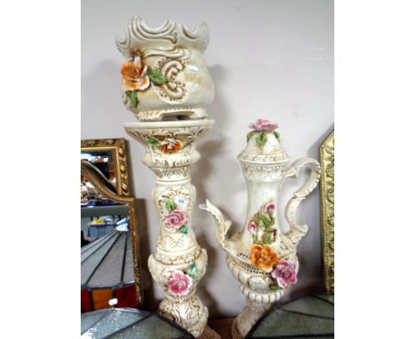 A continental glazed pottery floral decorated jardiniere and planter together with oversized teapot 