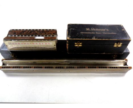 A Hohner bass harmonica in box plus one other 