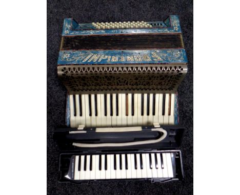 An Italian Frontalini piano accordion together with a Suzuki Melodion 