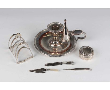 A George VI silver four-division toast rack, Birmingham 1937 by Roberts &amp; Dore Ltd, length 7.7cm, a silver circular box a