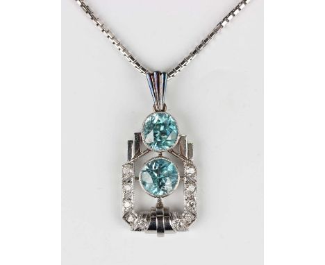 An Art Deco diamond and blue zircon pendant, collet set with a cushion shaped blue zircon above a circular cut blue zircon wi