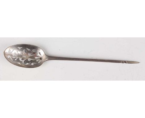 A George III silver mote spoon with tapered stem and pyramid finial, the bowl pierced with stylized scallop shells and scroll