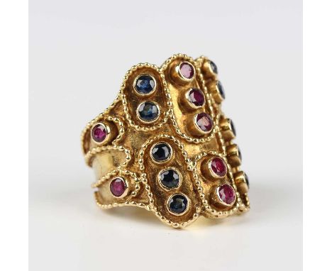 A Zolotas gold, ruby and sapphire ring, collet set with alternating rows of circular cut sapphires and rubies, otherwise with