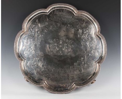 An impressive Victorian silver salver of lobed circular form, the centre finely engraved with the Wade family crest of a dog 