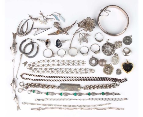 A group of mostly silver jewellery, comprising six rings, two necklaces and chains, two brooches, a tie clip, a pair of cuffl