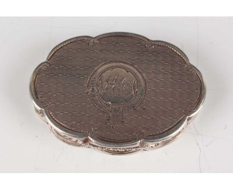 A Victorian silver lobed oval engine turned vinaigrette, the hinged lid revealing a hinged gilt grille, pierced and engraved 